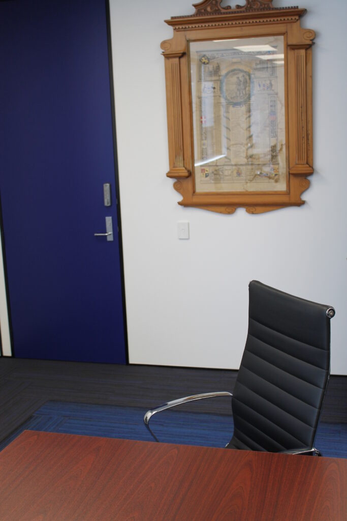 Briscoes HQ Morningside: Grey carpet in the open-plan office and grey timber-look planks in the kitchen and corridor