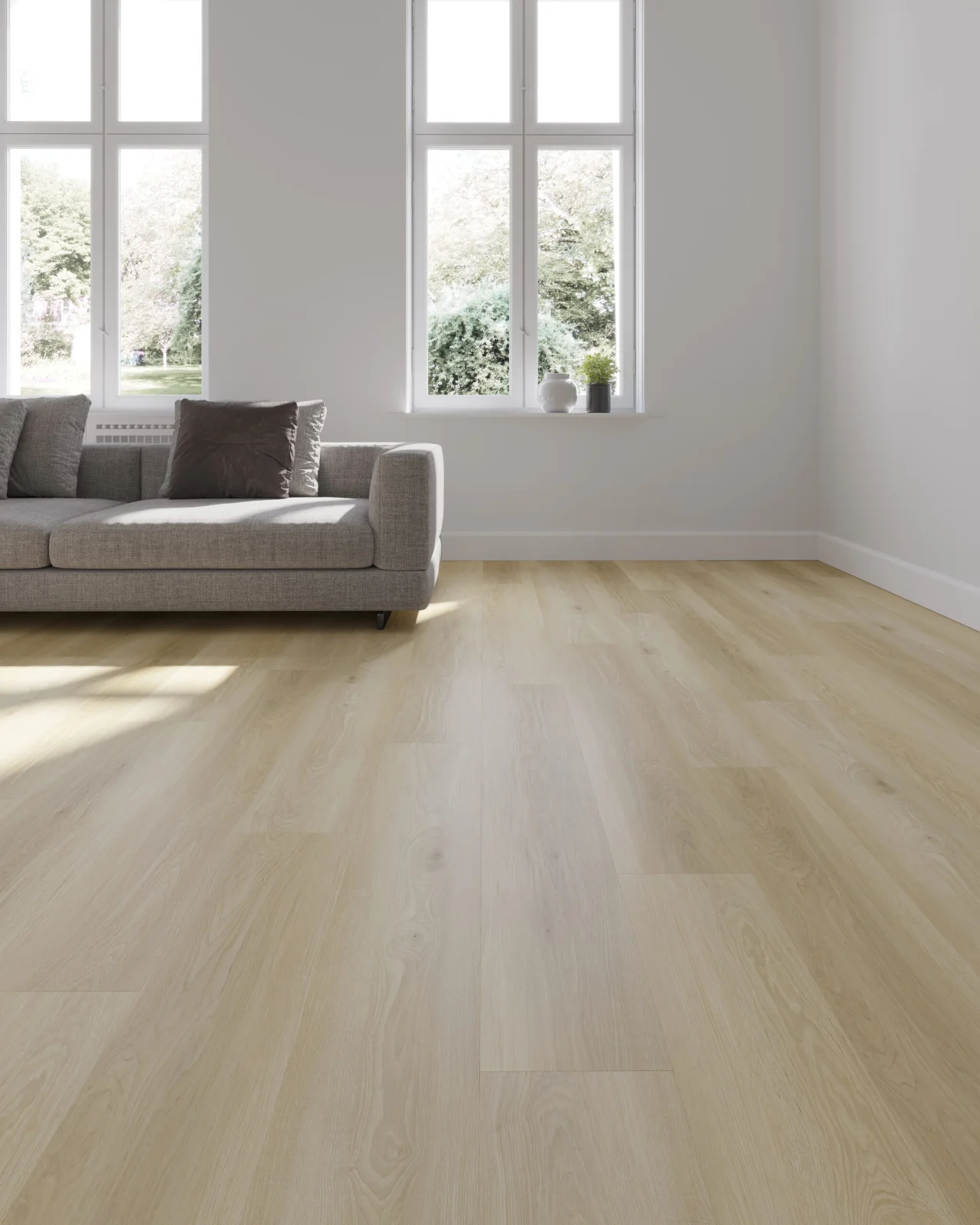 Living room corner with a grey sofa on light oak-look flooring