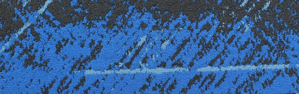 Blue and black diagonal-pattern carpet tile plank